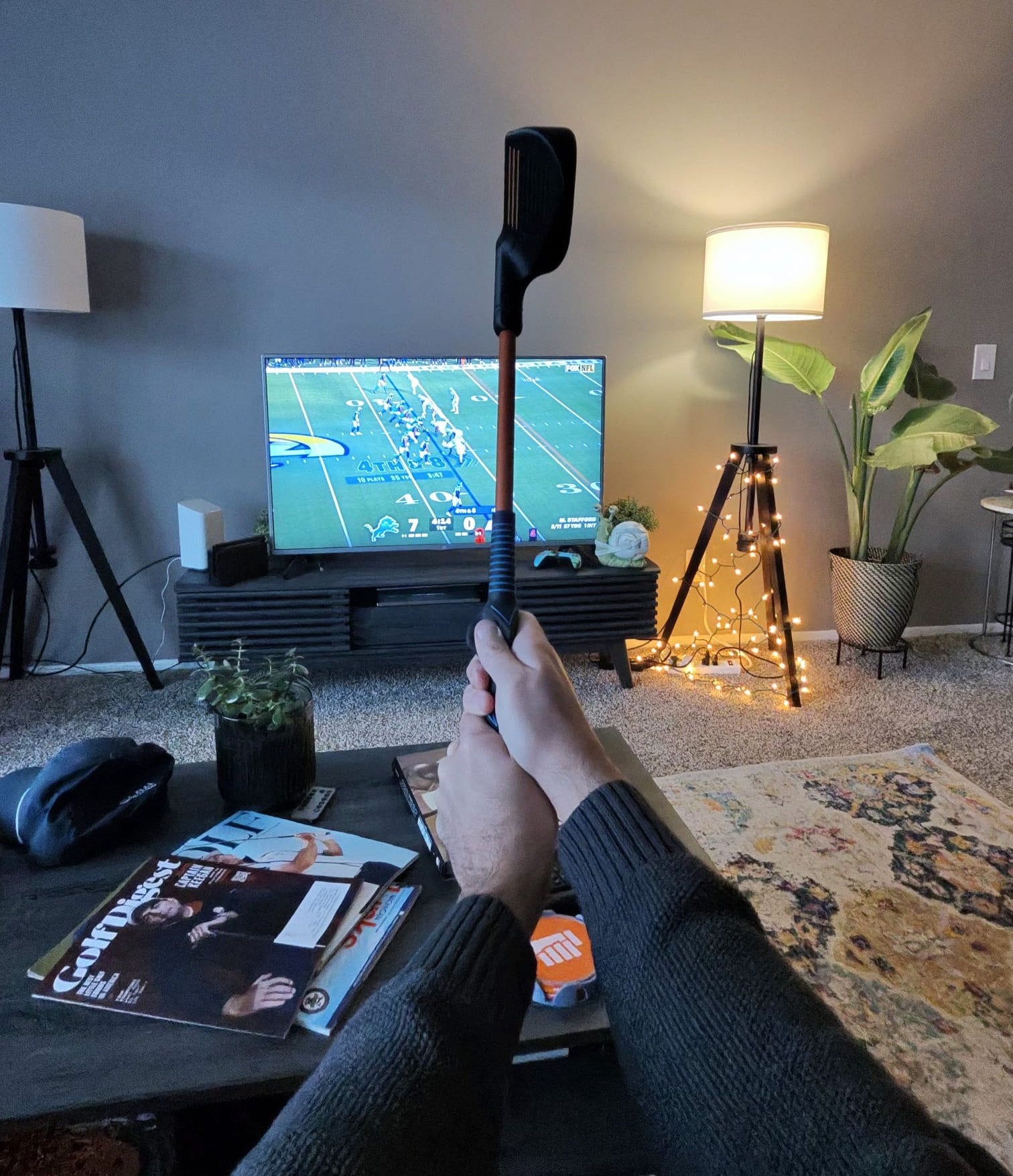 On the couch with a Compact Club in hand and the game on TV